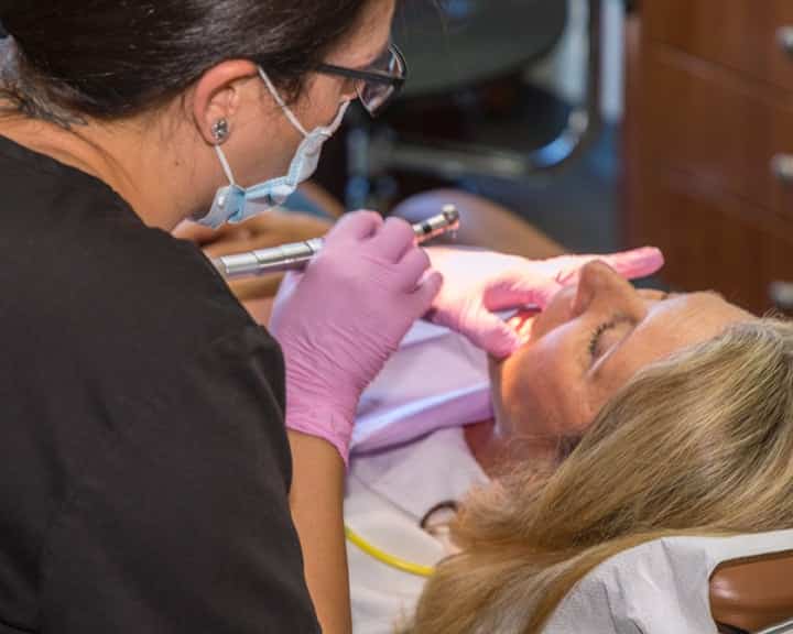 Dentist with patient image
